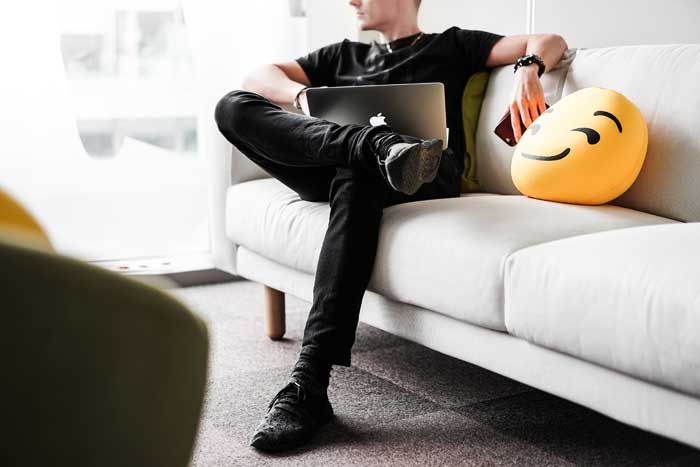 Young man sitting on a couch