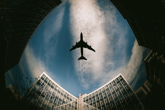 plane between buildings