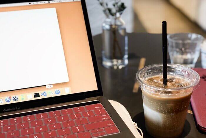 drink beside laptop