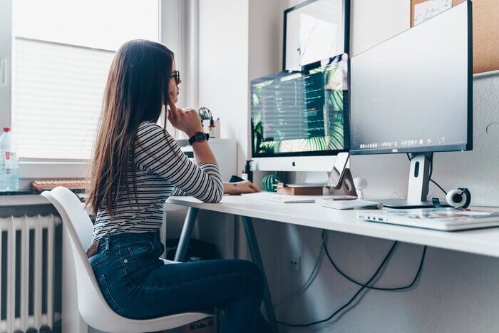 girl using desktop computer