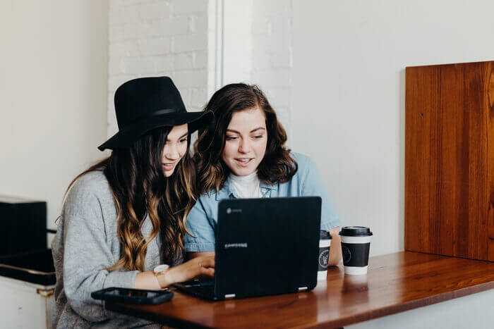 two girls at laptop